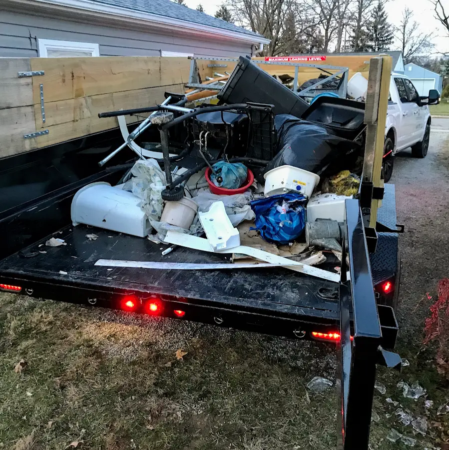 Roll-off dumpster delivered to a residential driveway in La Follette